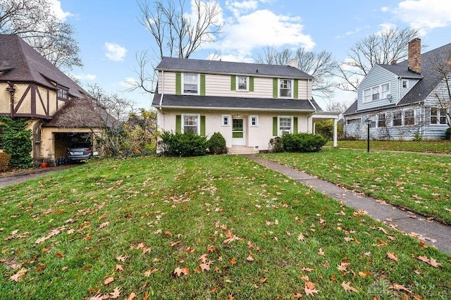 view of property featuring a front lawn