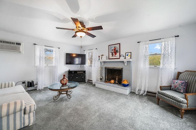 living room featuring ceiling fan, carpet floors, a wall unit AC, and a brick fireplace