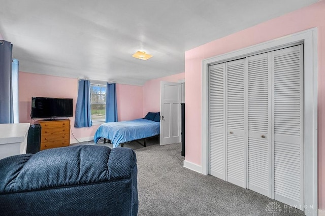 carpeted bedroom featuring a closet