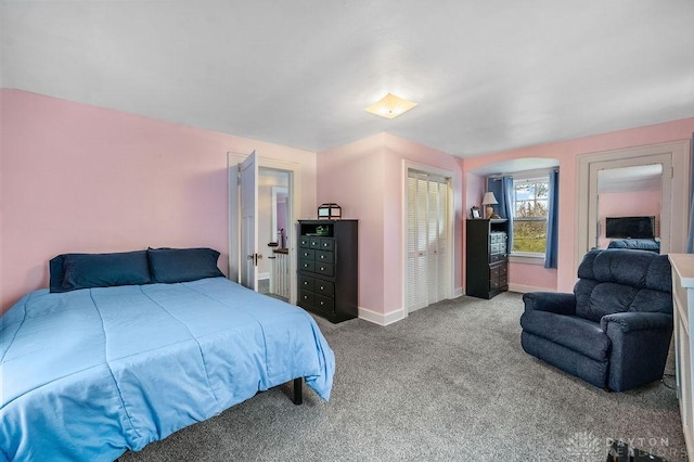 carpeted bedroom with a closet