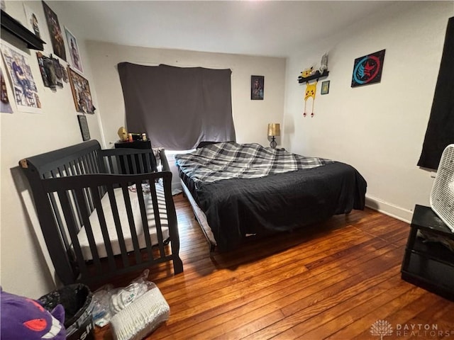 bedroom featuring dark hardwood / wood-style floors