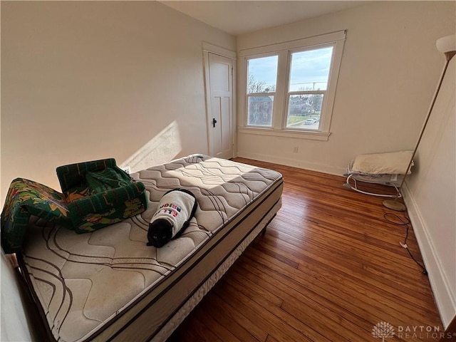 bedroom featuring dark wood-type flooring