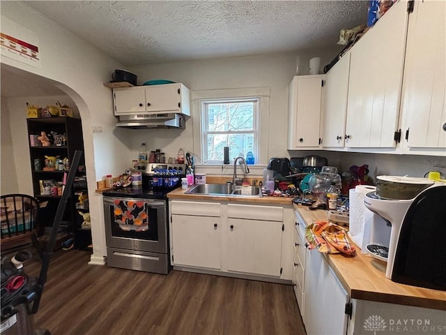 kitchen with stainless steel electric stove, sink, white cabinets, and a textured ceiling