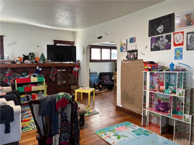 rec room with wood-type flooring