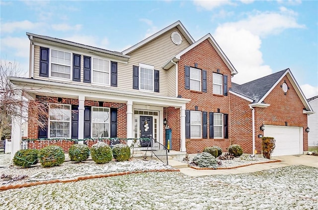 view of front facade featuring covered porch, brick siding, driveway, and an attached garage