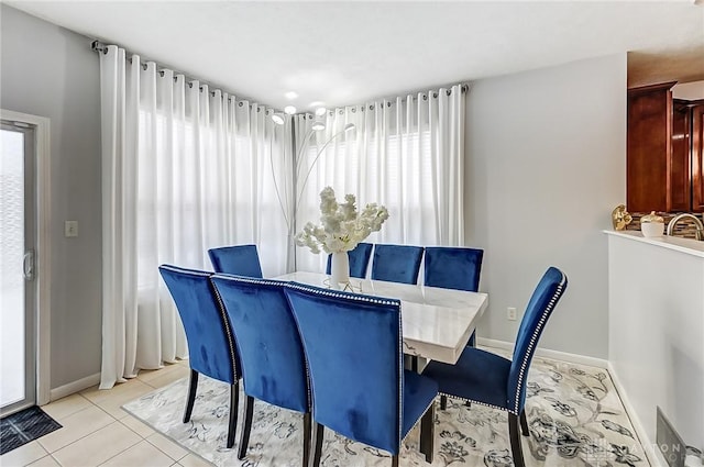 dining room featuring light tile patterned floors