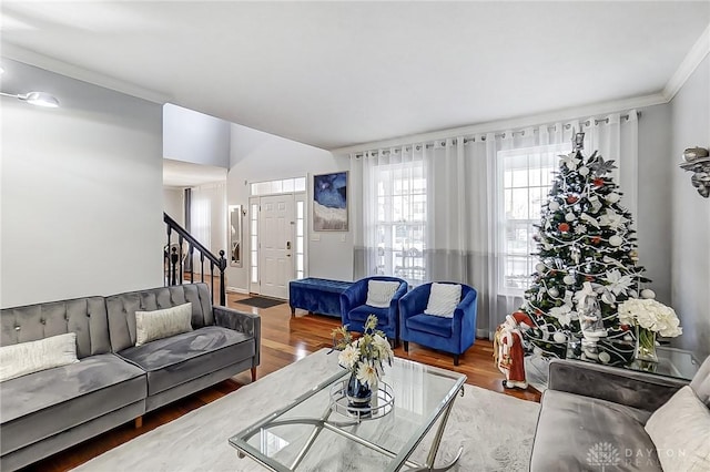 living room featuring ornamental molding and hardwood / wood-style floors