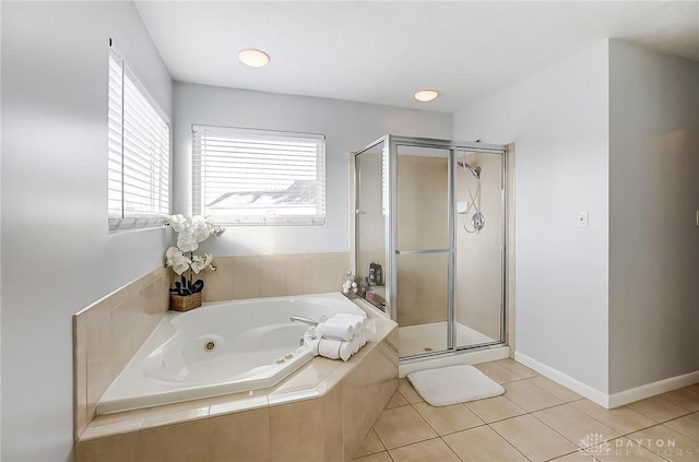 bathroom featuring independent shower and bath and tile patterned flooring