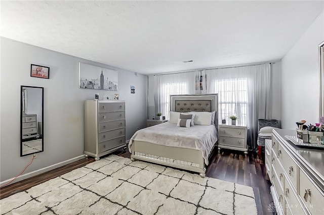 bedroom with wood-type flooring