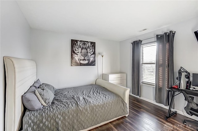 bedroom featuring dark hardwood / wood-style flooring