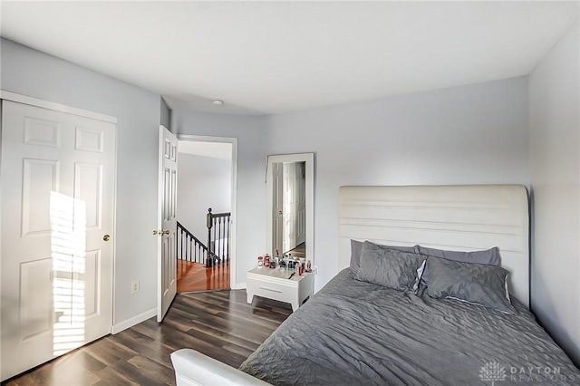 bedroom featuring dark wood-type flooring