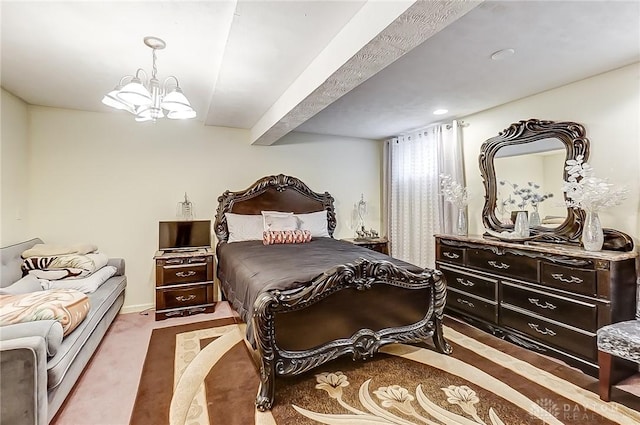 carpeted bedroom with an inviting chandelier