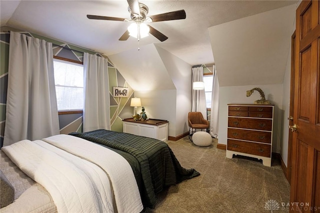 bedroom with ceiling fan, carpet, and vaulted ceiling