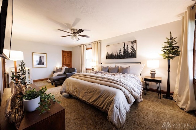 bedroom featuring ceiling fan and carpet