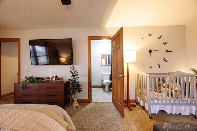 carpeted bedroom with connected bathroom