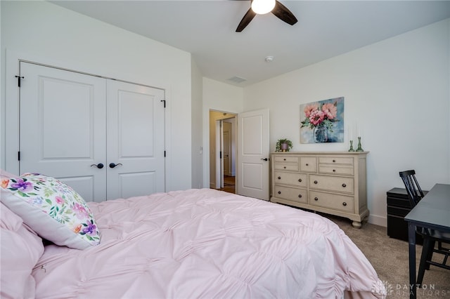 bedroom featuring carpet, ceiling fan, and a closet