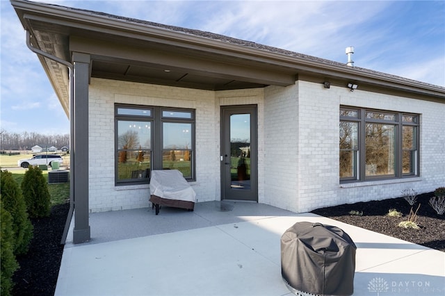 doorway to property with a patio