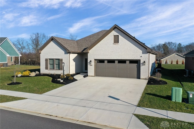 view of front facade with a front yard and a garage