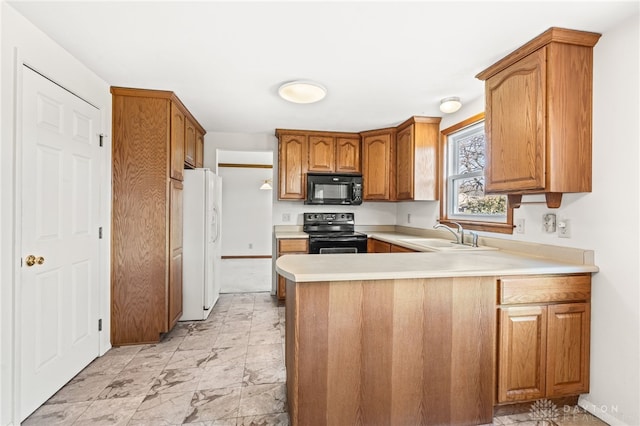 kitchen featuring kitchen peninsula, sink, and black appliances