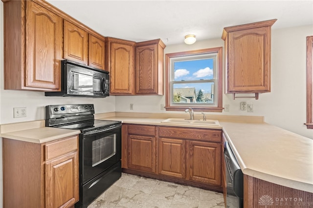 kitchen with black appliances and sink