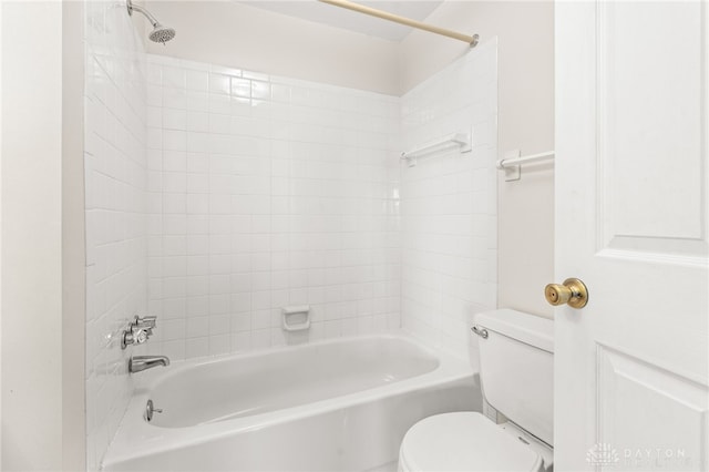 bathroom with toilet and washtub / shower combination