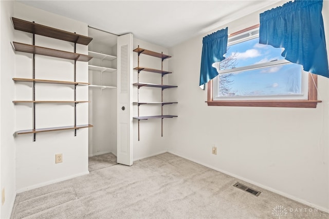 unfurnished bedroom featuring light colored carpet