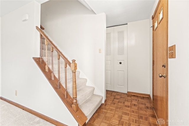 entrance foyer with dark parquet flooring