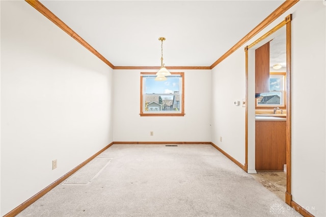 unfurnished dining area featuring light carpet and crown molding