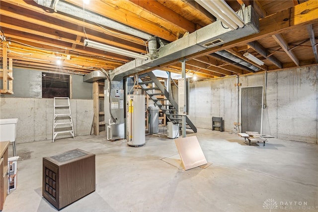 basement featuring heating unit and water heater