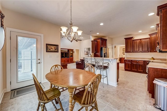 dining room with plenty of natural light and a chandelier