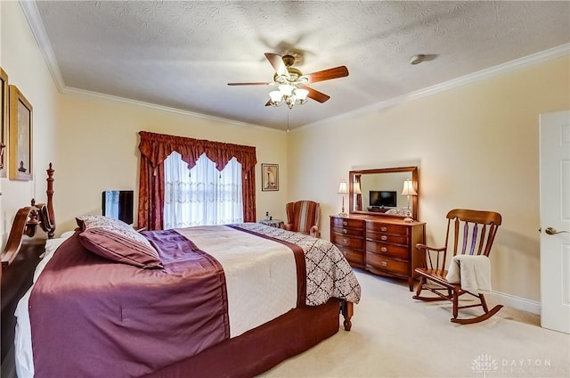 bedroom with ceiling fan, ornamental molding, and a textured ceiling