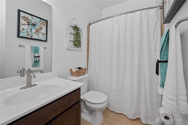 bathroom with tile patterned floors, vanity, and toilet