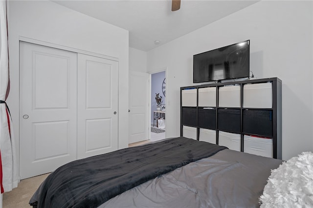 carpeted bedroom featuring a closet and ceiling fan