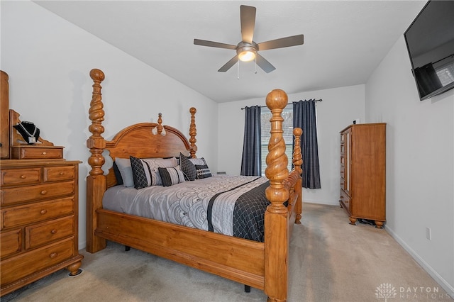 bedroom with ceiling fan and light colored carpet