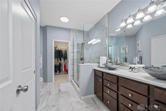 bathroom featuring vanity, toilet, and walk in shower