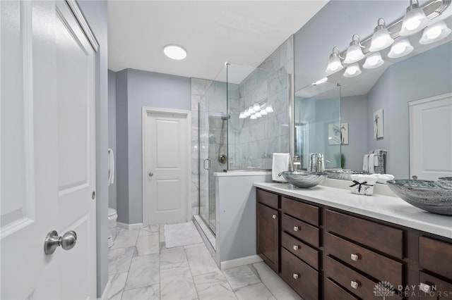 bathroom featuring vanity, toilet, and an enclosed shower