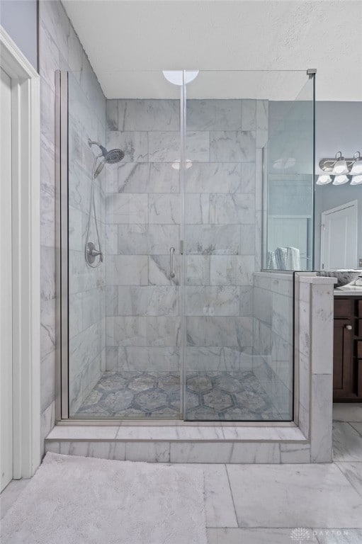 bathroom with vanity and walk in shower