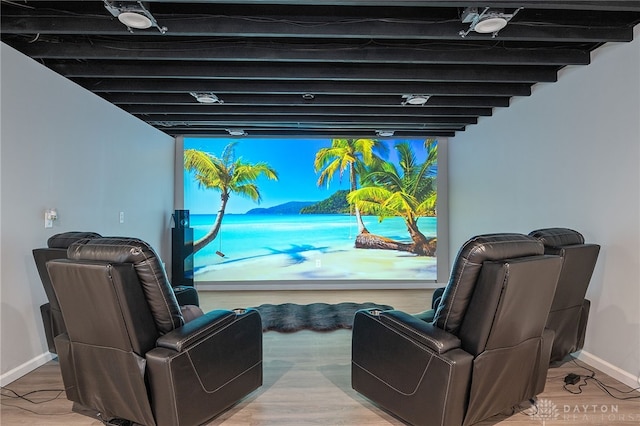 home theater room with wood-type flooring