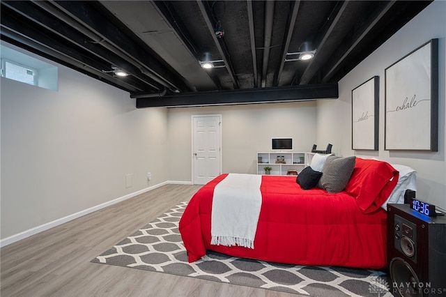 bedroom featuring hardwood / wood-style flooring