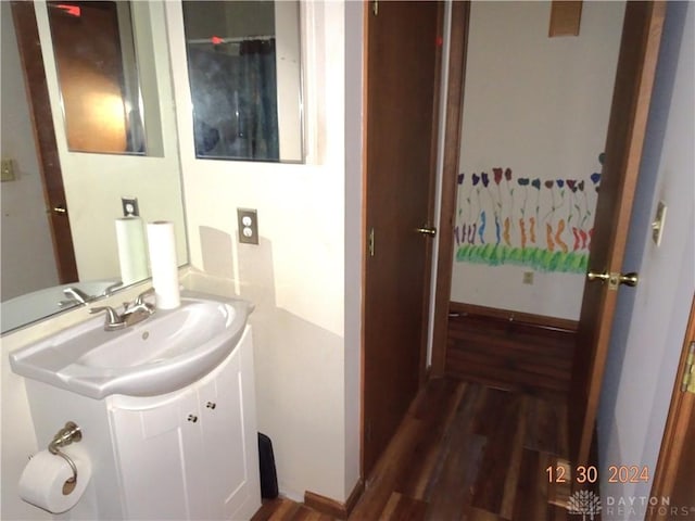 bathroom featuring hardwood / wood-style floors and vanity