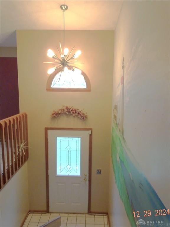 foyer featuring a notable chandelier