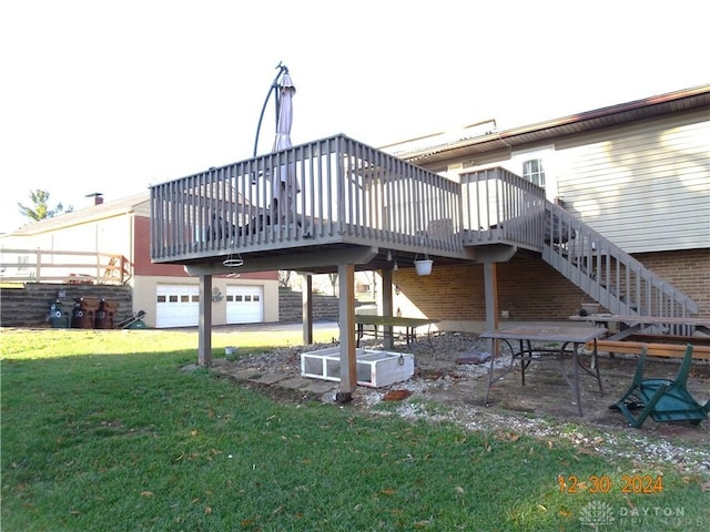 back of property with a lawn and a wooden deck