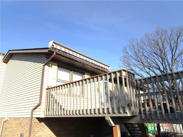 view of property exterior featuring a balcony