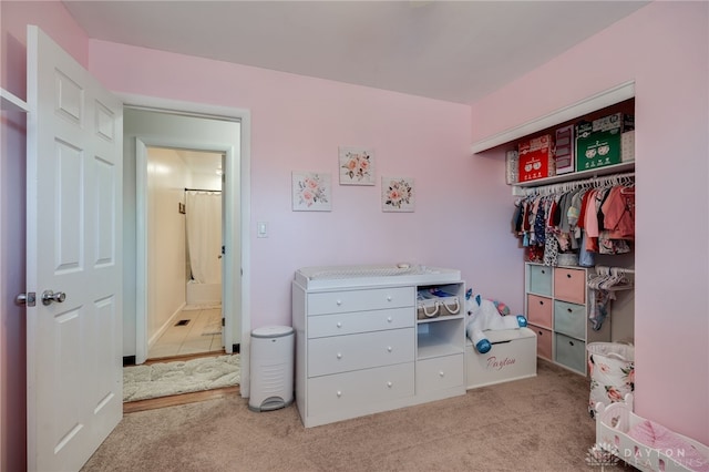 bedroom featuring light colored carpet