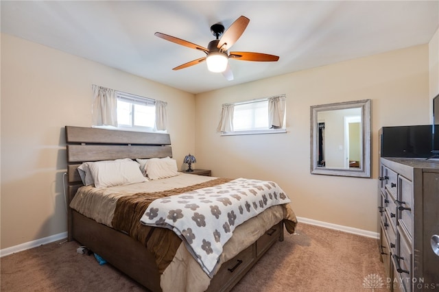 bedroom with light carpet, ceiling fan, and baseboards