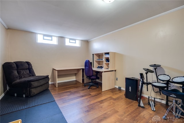 office area with baseboards, ornamental molding, and wood finished floors