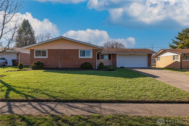 ranch-style house with a front lawn and a garage