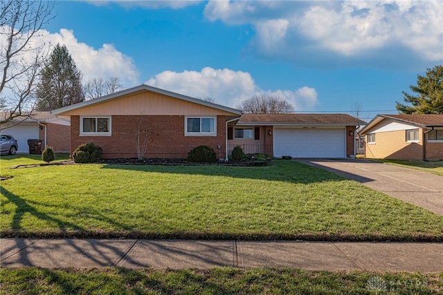 single story home with a garage and a front yard