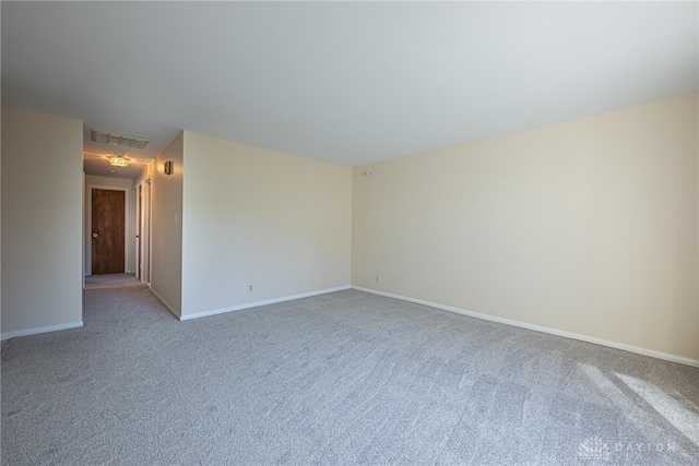 unfurnished room featuring carpet