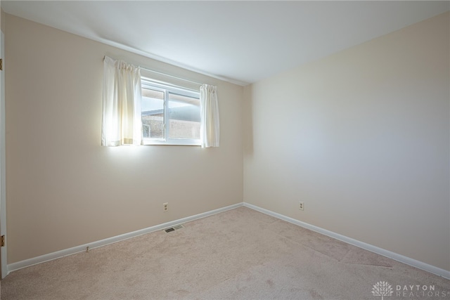 view of carpeted spare room